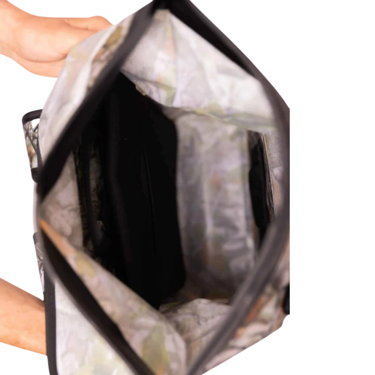 Top-down view into the open Forest Camo Dry Pocket backpack, showing the wide opening and interior.