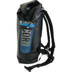 Side view of a black COR Surf dry bag with a bottle in its mesh pocket and shoulder straps visible.
