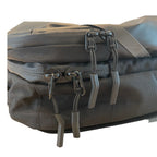 Close-up of the backpack zipper tracks and corded zipper pulls.