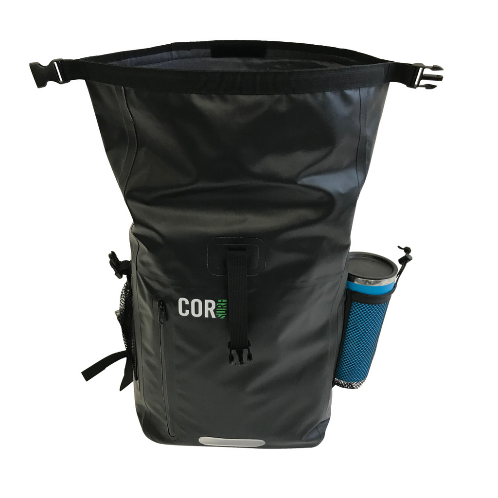 Black COR Surf dry bag with the roll-top opening unfolded and a bottle in the side pocket.